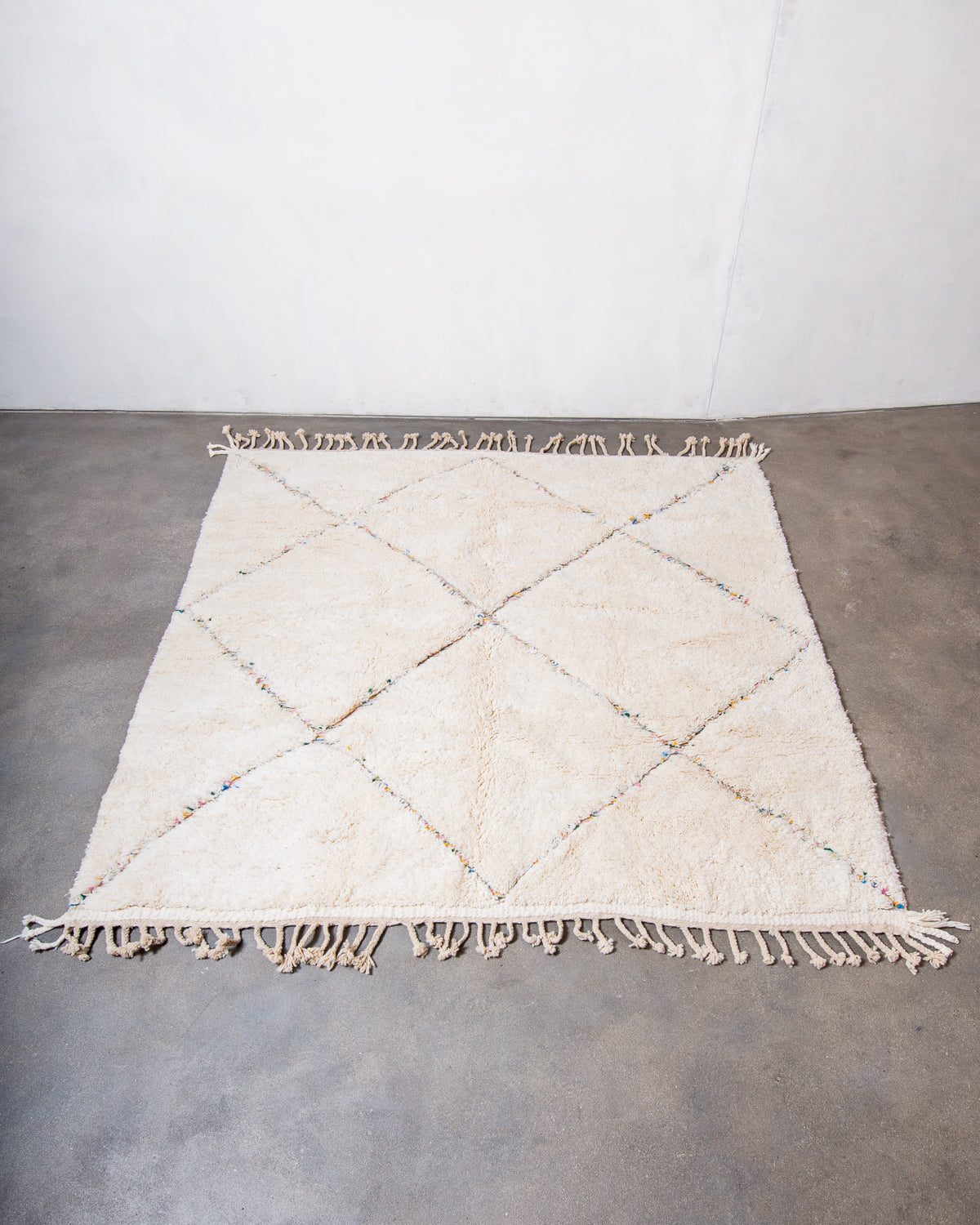 Modern, designer, handcrafted Berber rug from Morocco. Beniourain carpet with beautiful colours and patterns and fluffy wool texture.